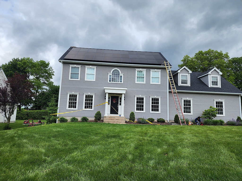Solar panel installation on colonial home - front view