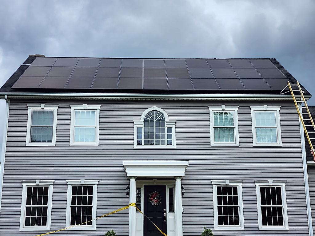 Solar panel installation on colonial home - close up