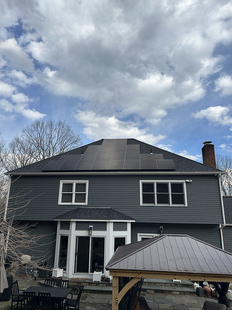 Solar panels on hip roof - rear view with patio