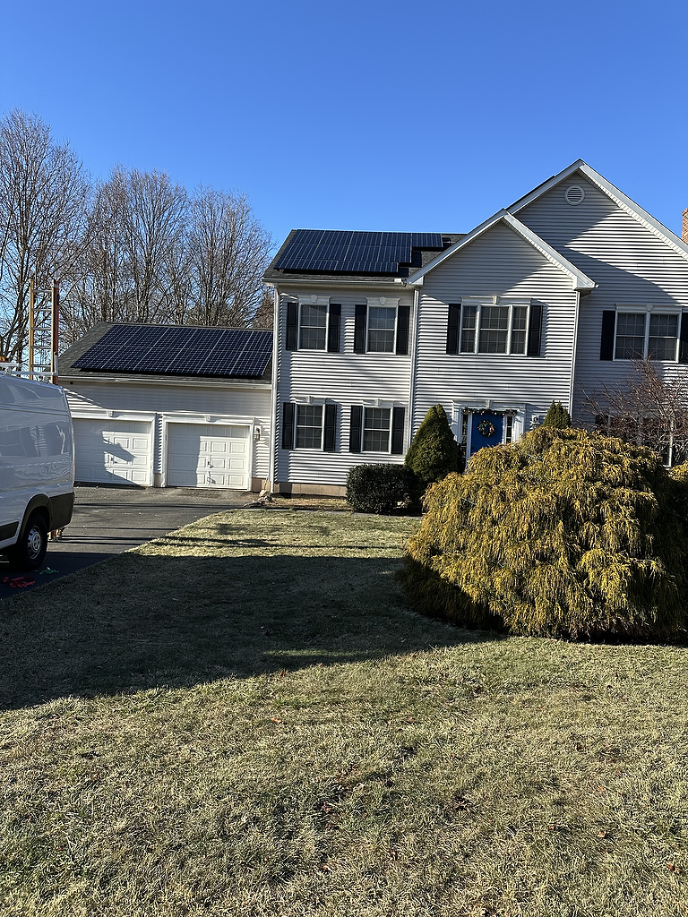 Solar panels on garage and home rooftop