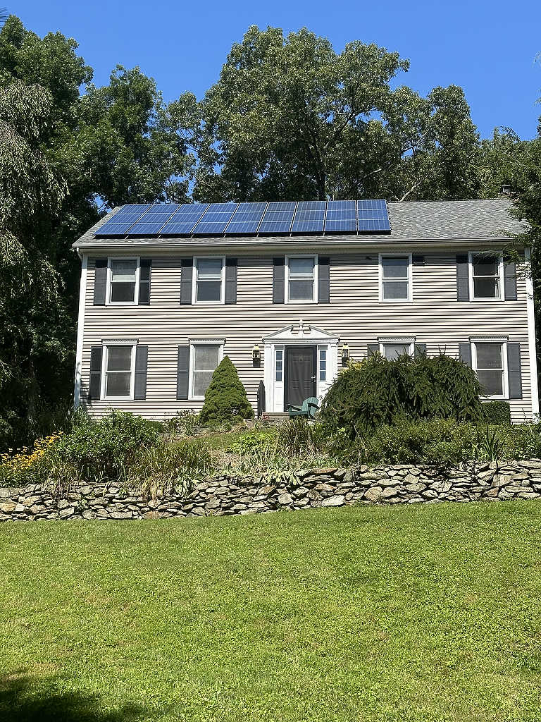 Solar panels on classic New England home